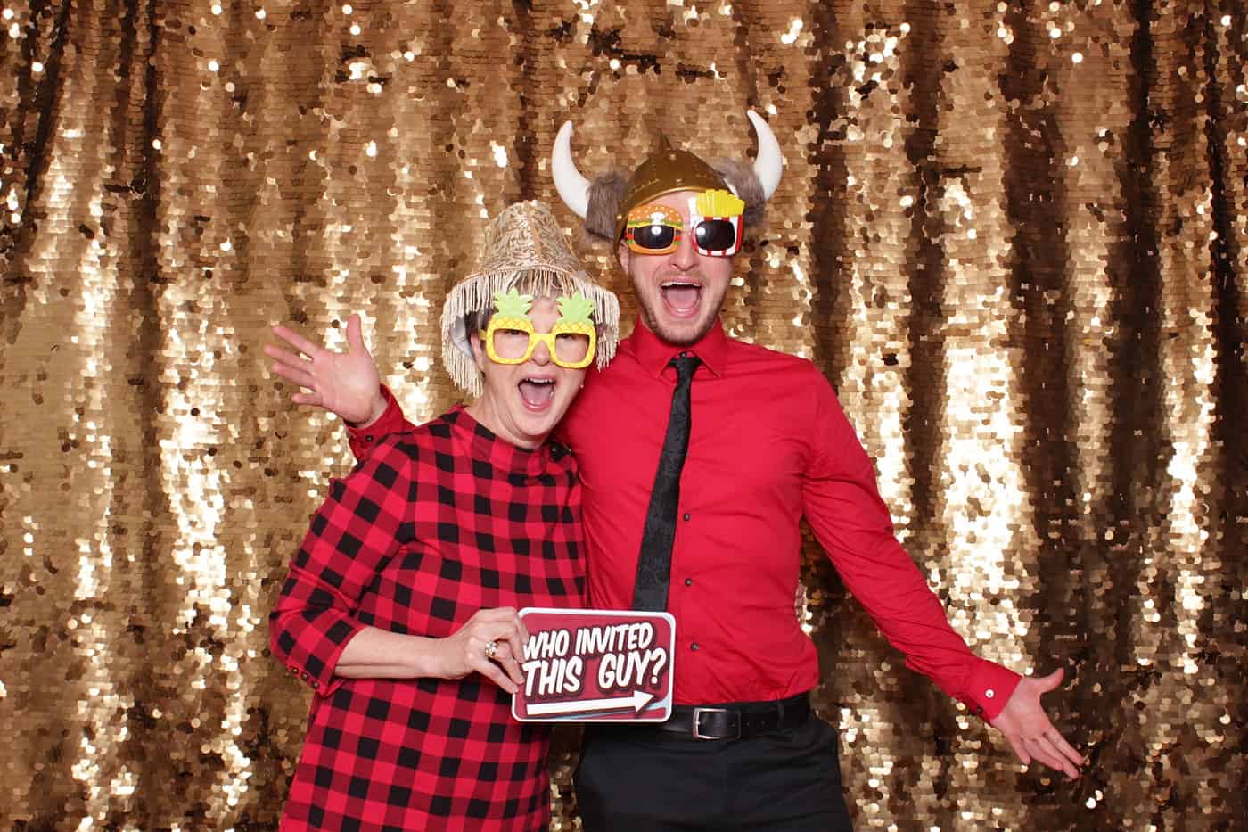 photo booth photo from a wedding reception with gold sequin backdrop