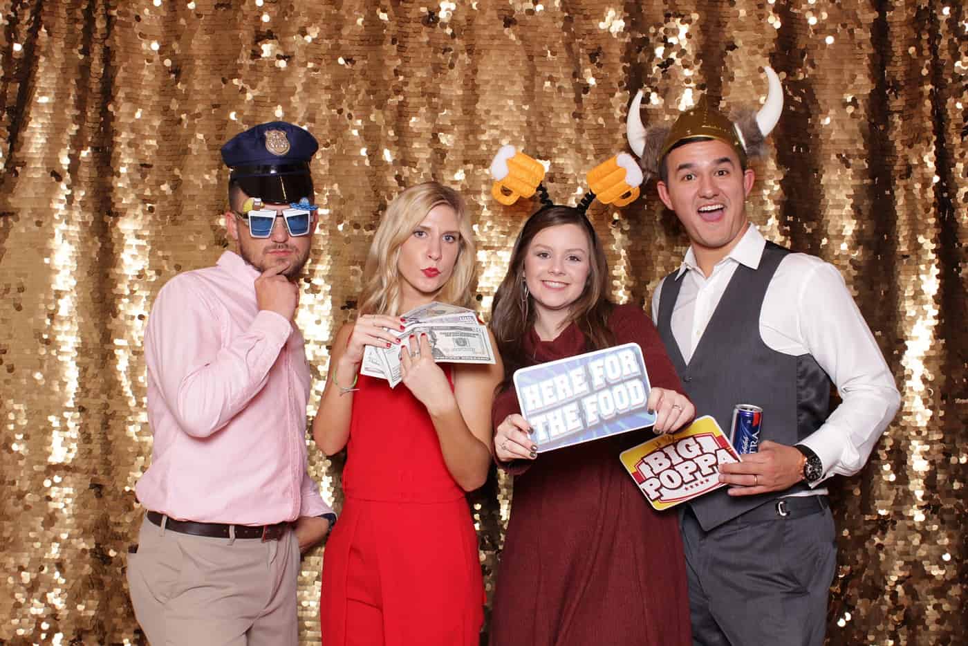 photo booth photo from a wedding reception with gold sequin backdrop