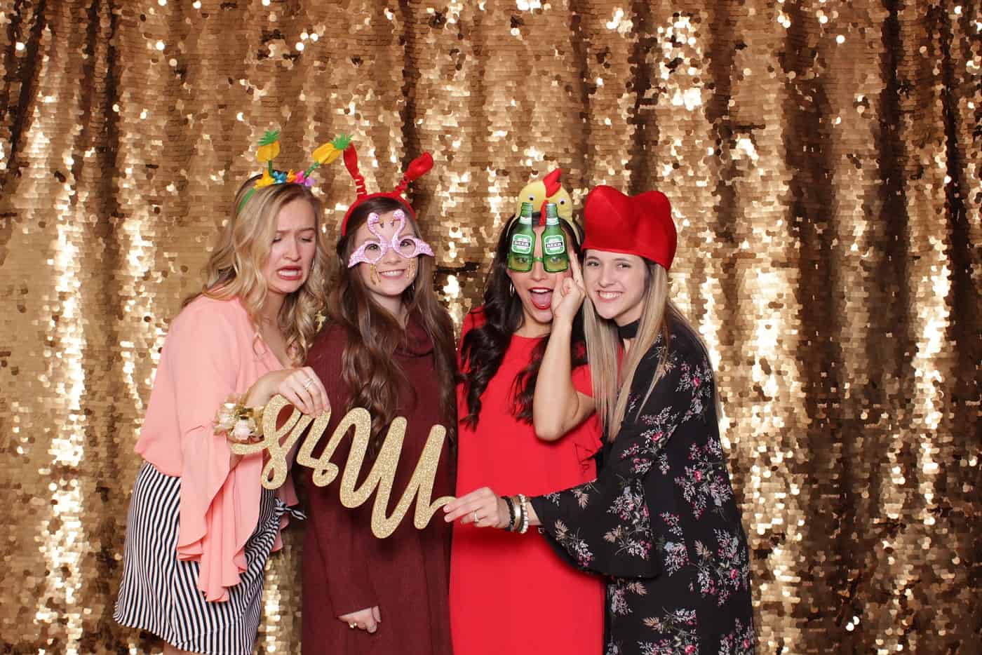 photo booth photo from a wedding reception with gold sequin backdrop